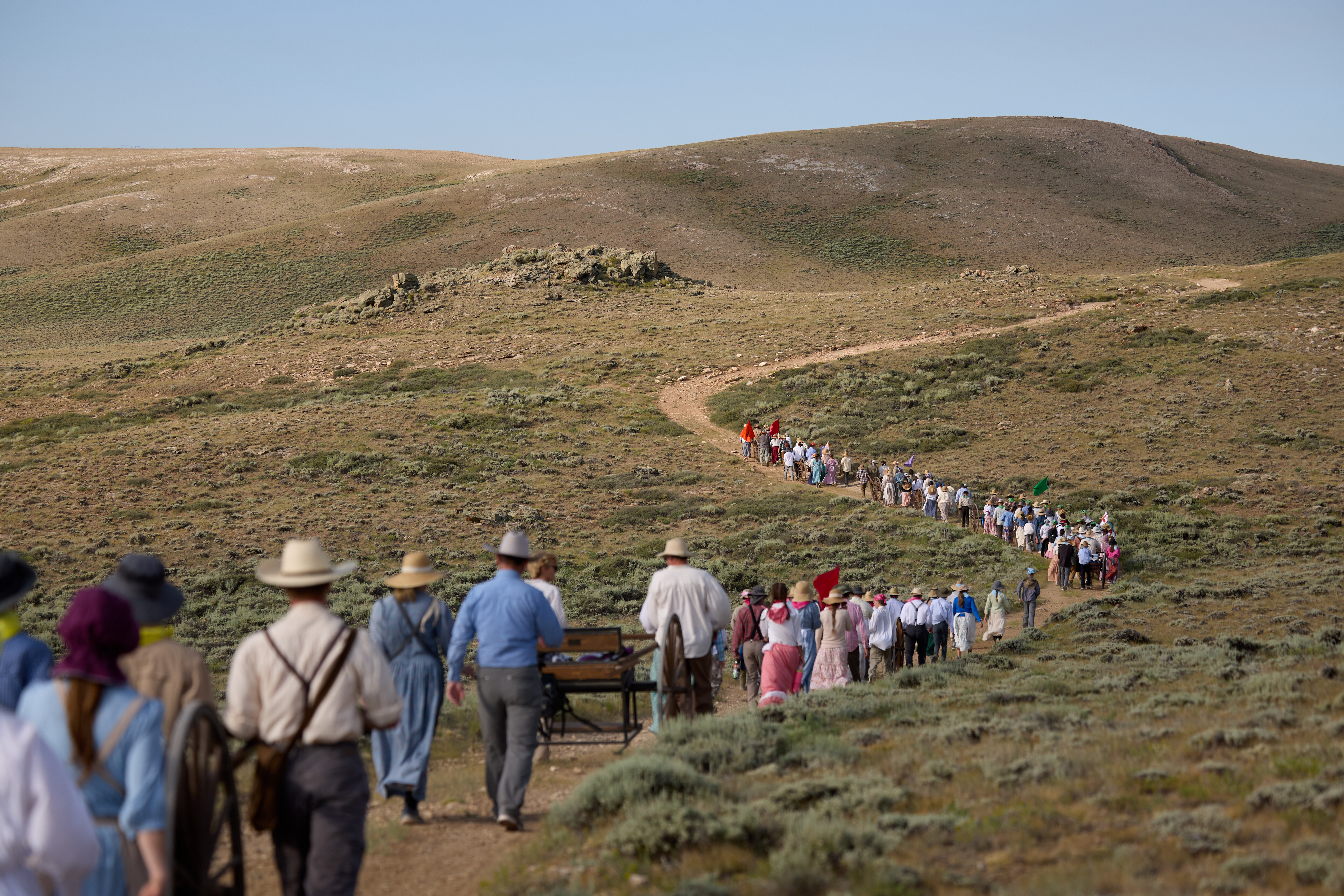 Youth and leaders from the Hooper Utah Pioneer Trail Stake pull handcarts along the Wyoming Mormon Trail near Lander, Wyoming, as they relive a mid-1800s pioneer experience known today as “trek” by members of The Church of Jesus Christ of Latter-day Saints, July 7-9, 2025.