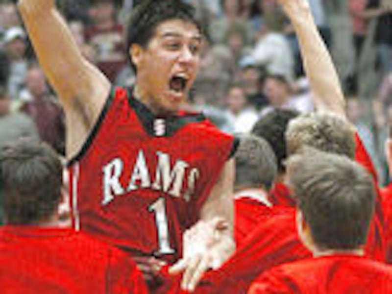 South Sevier's Carson Christensen celebrates with teammates after Rams' 2A championship Saturday.