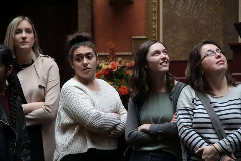 Sydney Ward, second from the right, stands in the Utah State Capitol on a tour visiting with legislators.