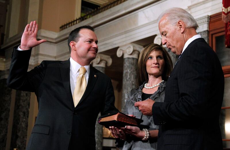 Then-Vice President Joe Biden administers a ceremonial Senate oath to Sen. Mike Lee, R-Utah, left, who is accompanied by his wife Sharon, Jan. 5, 2011, in the Old Senate Chamber on Capitol Hill in Washington.