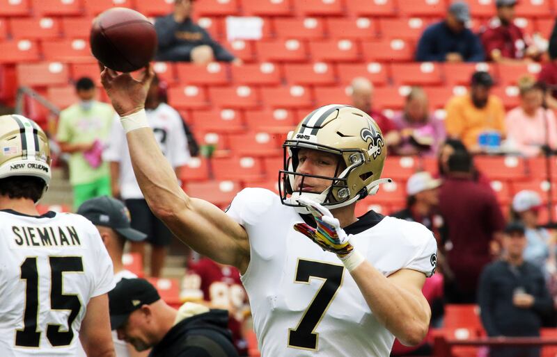 New Orleans Saints quarterback Taysom Hill throws before during an NFL football game against the Washington Football Team.