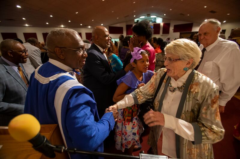 The Rev. France Davis shakes hands with Susan Rose, of Fill the Pot Ministry, at Calvary Baptist Church in Salt Lake City on Sunday, April 28, 2019. After 45 years, the Rev. Davis will retire as pastor of Calvary Baptist Church at the end of the year.