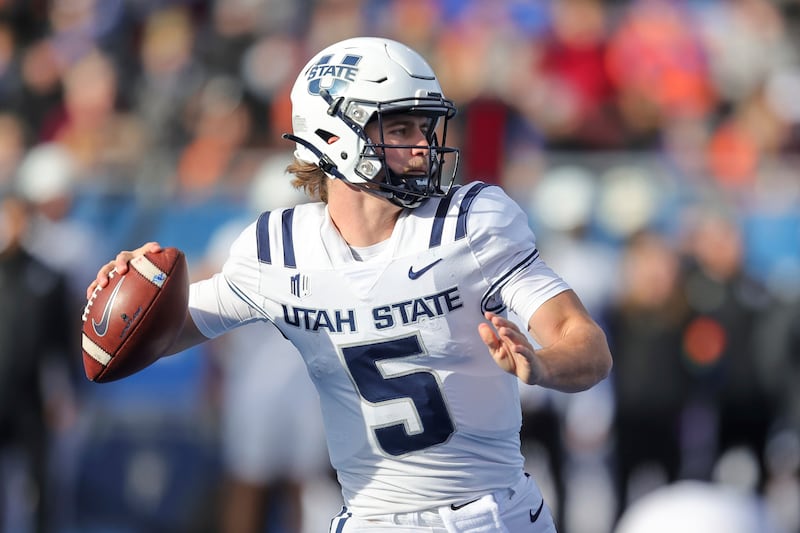 Utah State quarterback Cooper Legas looks to throw against Boise State on Nov. 25, 2022.