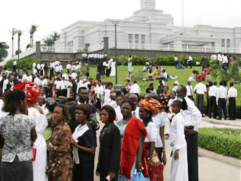 Members in Nigeria gather during the dedication of the Aba Nigeria Temple on Aug. 7, 2005.  The Church of Jesus Christ of Latter-day Saints has indefinitely closed the temple because of recent violence and has evacuated temple workers to other areas.