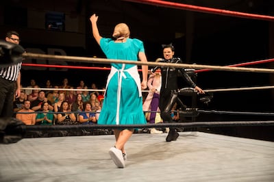 Maquel Cooper participates in a wrestling match during "The Bachelor."