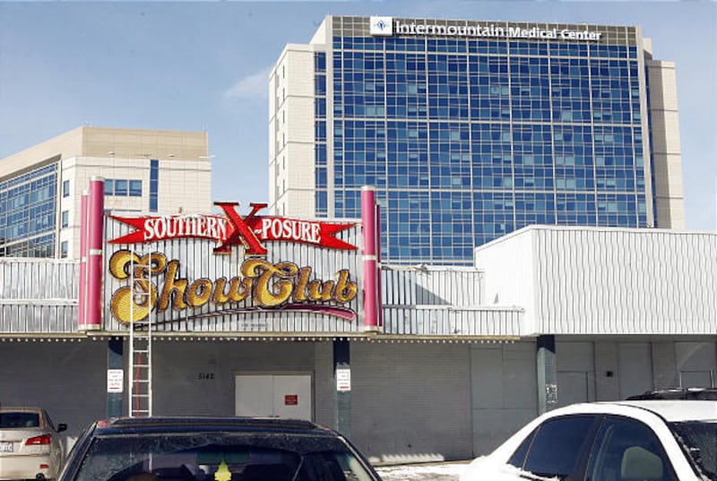 Southern Exposure greets passers-by on State Street in Murray, with the Intermountain Healthcare complex looming behind it.