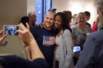 Josh Holt poses for a photo with Rep. Mia Love, R-Utah, during a welcome-home event in the Old Dome Meeting Hall at Riverton City Park in Riverton, Utah, Monday, May 28, 2018. Love helped