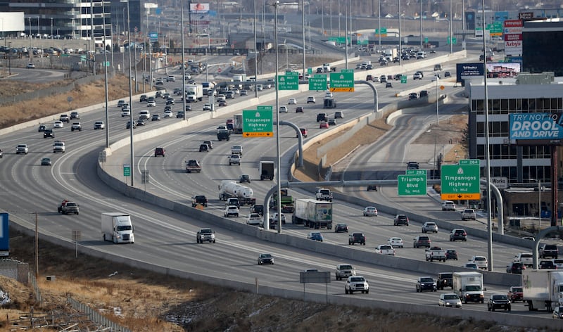 Cars drive on I-15 in Lehi.