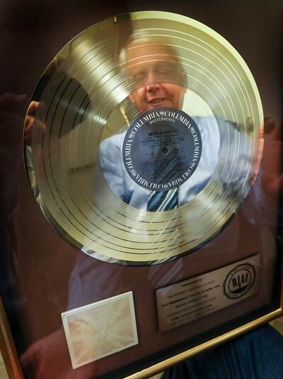 Tabernacle Choir president Ron Jarret is reflected in a commemorative gold record for the "The Joy of Christmas" album in the choir offices in the Salt Lake Tabernacle in Salt Lake City on Thursday, Oct. 4, 2018.