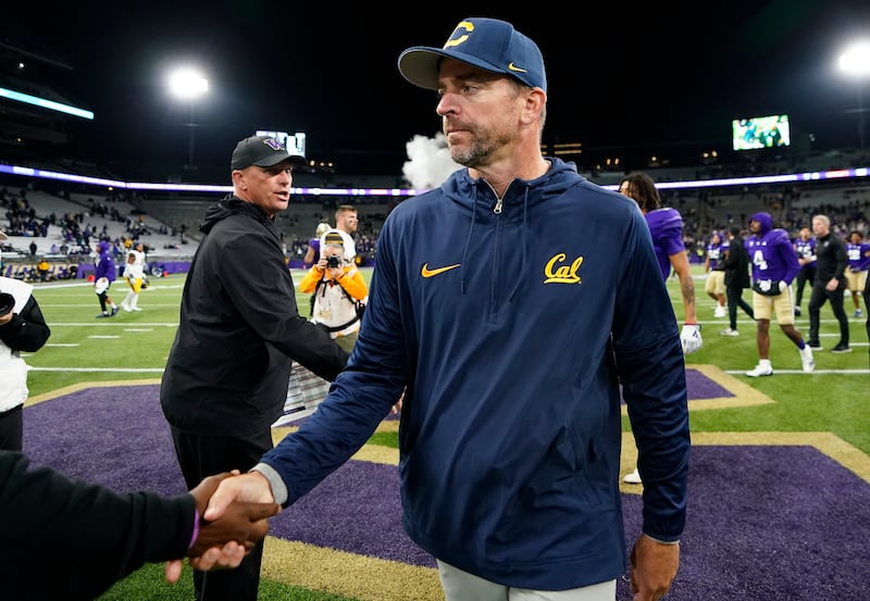 California coach Justin Wilcox walks away after shaking hands with Washington coach Kalen DeBoer Saturday, Sept. 23, 2023, in Seattle.
