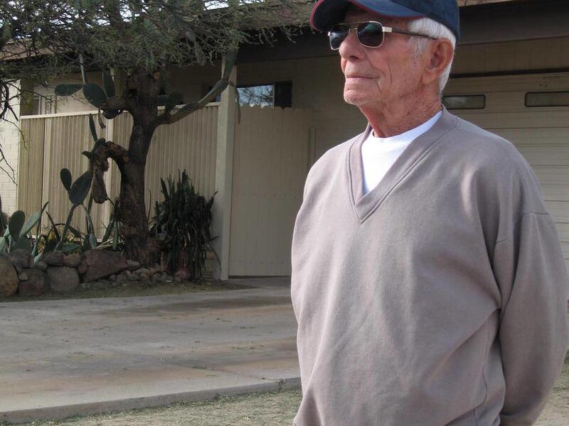 In this Feb. 18, 2011 photo, George Gayan, a neighbor of Amy and Randy Loughner, who are the parents of accused mass shooter Jared Loughner stands near the Loughner home in Tucson, Ariz. Neighbors say Loughner, reclusive even before the Jan. 8 shootings,