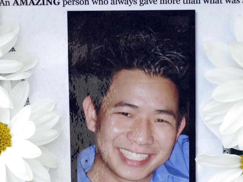 A makeshift memorial is shown at the site where Huy Pham, pictured, jumped off a building committing suicide March 17, 2011 after receiving notice he was about to be laid off from his job in Costa Mesa, Calif. Police on Friday probed the last hours of Pha