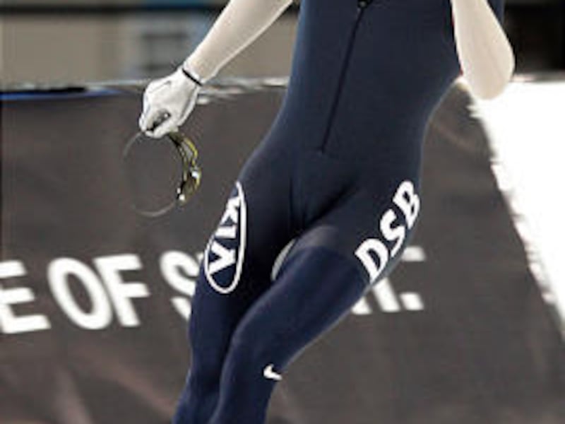 Tucker Fredricks celebrates his win in the men's 500 meters Sunday at the Kearns Olympic Oval.