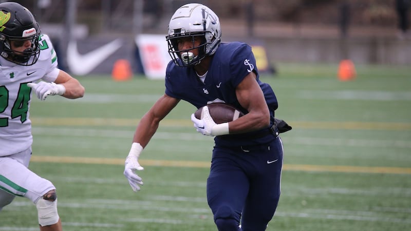 University of Utah commit LaMarcus Bell carries the ball for Lake Oswego High in Oregon.