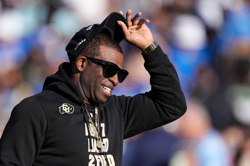 Colorado coach Deion Sanders stands on the field prior to a game against UCLA Saturday, Oct. 28, 2023, in Pasadena, Calif.