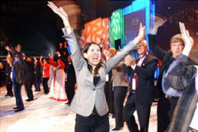 Giselle Sexsmith dances the twist at the Delta Center as part of an effort by Nu Skin conventiongoers to break a Guinness record as the biggest group to do the dance.