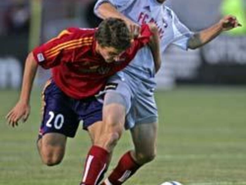RSL's Nikolas Besagno, left, battles for ball with FC Dallas' Ronnie O'Brien. Besagno, 16, became the second-youngest player to play in the MLS.