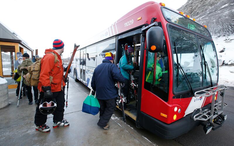 Skiers get on a UTA bus for a free ride at the Little Cottonwood Canyon Park & Ride lot on Jan. 13, 2016.