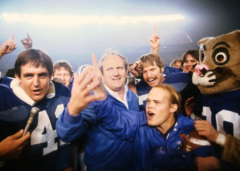 BYU coach LaVell Edwards and players celebrate the team’s come-from-behind victory over SMU in the 1980 Holiday Bowl.