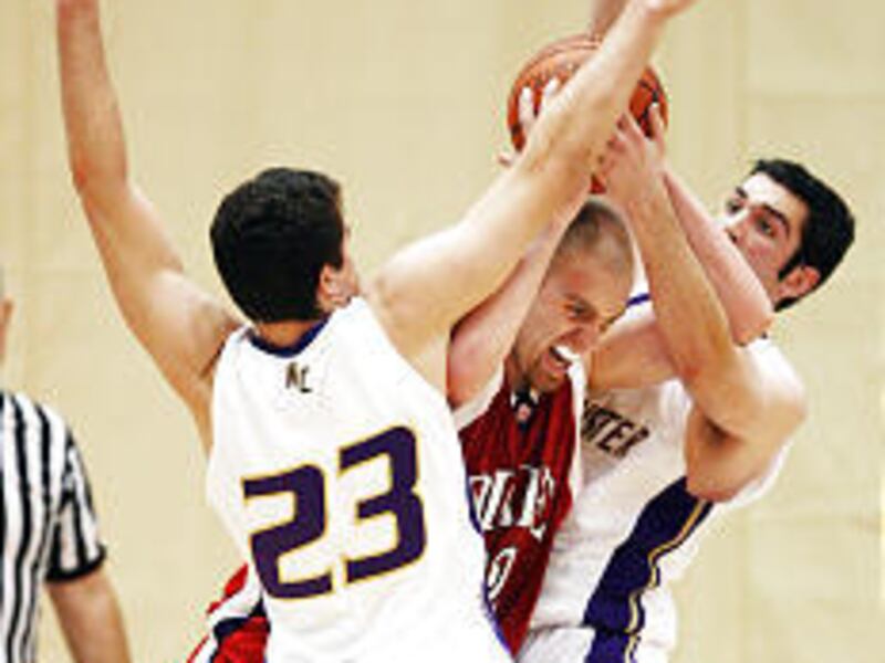 Westminster's Allen Schowengerdt (23) and Nate Sanchez defend Dixie's Troy Randall.