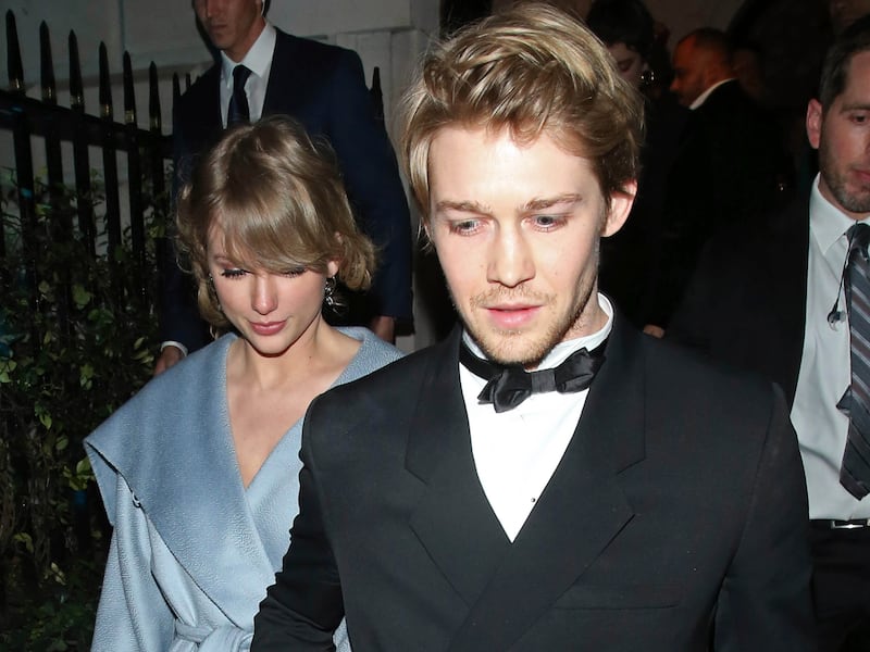 Taylor Swift and Joe Alwyn are seen leaving a party in 2019 in London. The two have reportedly split after six years together.