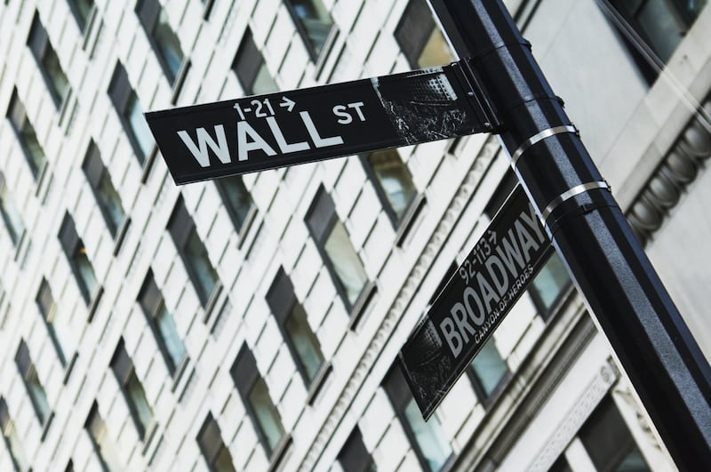 A street sign for Wall Street in New York City.