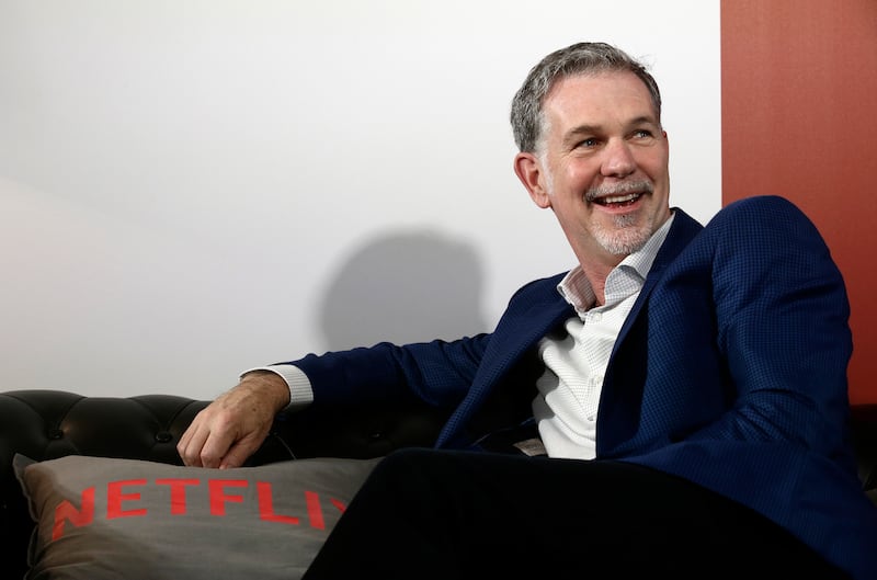 Netflix founder and CEO Reed Hastings smiles during an interview in Barcelona, Spain, Feb. 28, 2017. Hastings is investing $100 million in Utah’s Powder Mountain ski resort.