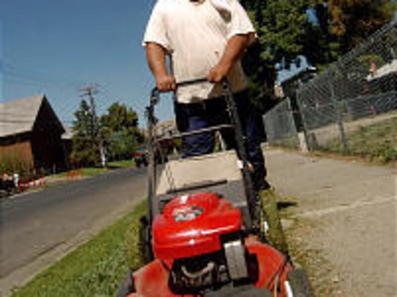 Joe Tupou mows his lawn in Salt Lake City. He won't allow his sons \— ages 17, 20 and 23 \— to do the yard work, because he loves the workout \— and it's cheaper than paying for physical therapy on his knee.