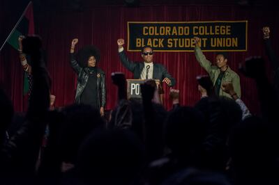 Laura Harrier, center left, stars as Patrice and Corey Hawkins, center right, as Stokely Carmichael in Spike Lee’s “BlacKkKlansman.”