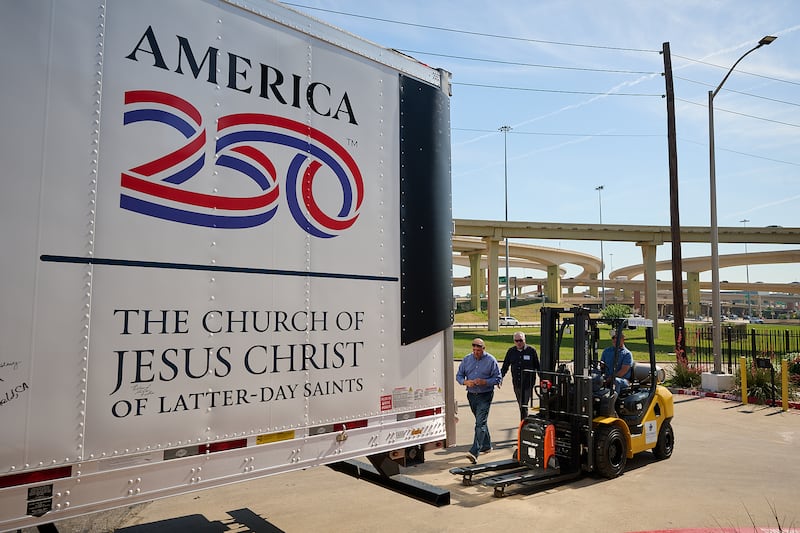 Volunteers help unload boxes from the food donation made by The Church of Jesus Christ of Latter-day Saints to Joe's Pantry in Dallas, Texas, on Thursday, May 14, 2026.