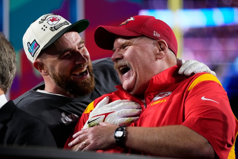 Kansas City Chiefs head coach Andy Reid and Travis Kelce celebrate their win after Super Bowl 57 on Feb. 12, 2023.