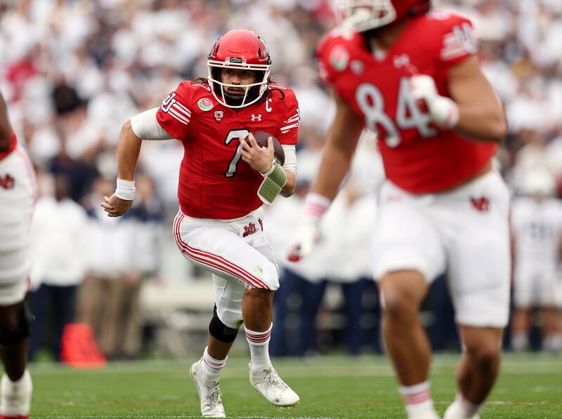Utah QB Cameron Rising scrambles from the pocket as Utah and Penn State play in the Rose Bowl in Pasadena, California.