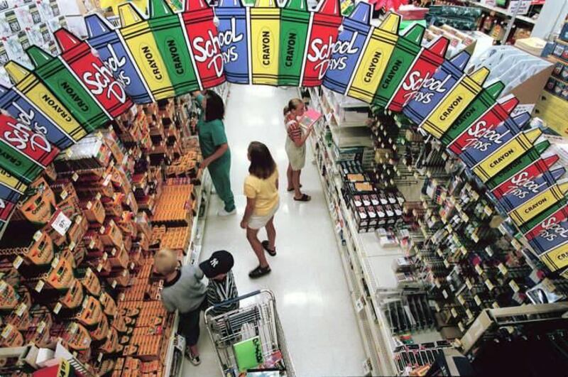 Customers buy items for school at Walmart.