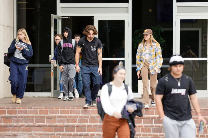 Students exit a building on the campus of Boise State University in Boise, Idaho.
