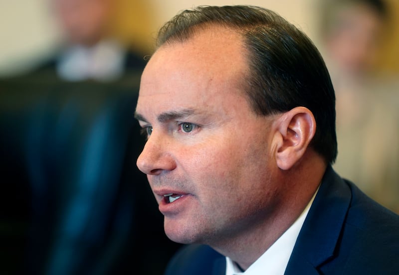 Sen. Mike Lee, R-Utah, meets with members of the Senate Minority Caucus at the Capitol in Salt Lake City.