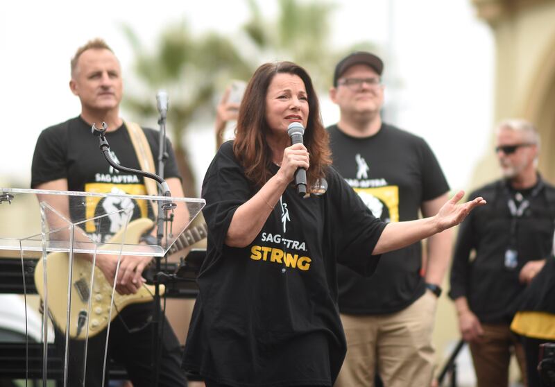 SAG-AFTRA President Fran Drescher, center, speaks during rally outside Paramount Pictures Studio on Sept. 13, 2023