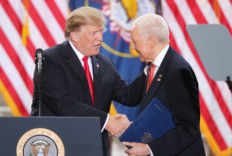 FILE - President Donald Trump shakes the hand of Sen. Orrin Hatch, R-Utah, after Hatch spoke at the Capitol rotunda in Salt Lake City on Dec 4, 2017. Trump was in Salt Lake City to announce reductions to the Grand Staircase-Escalante and Bears Ears nation