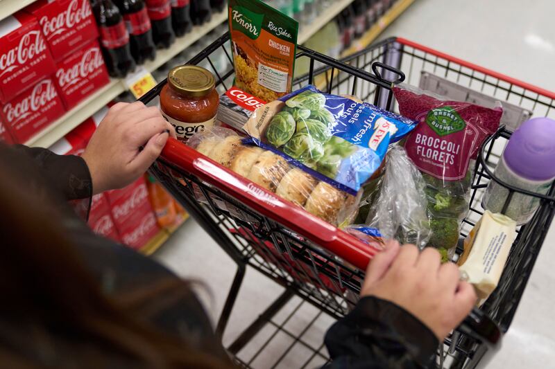 Jaqueline Benitez shops for groceries at a supermarket in Bellflower, Calif.