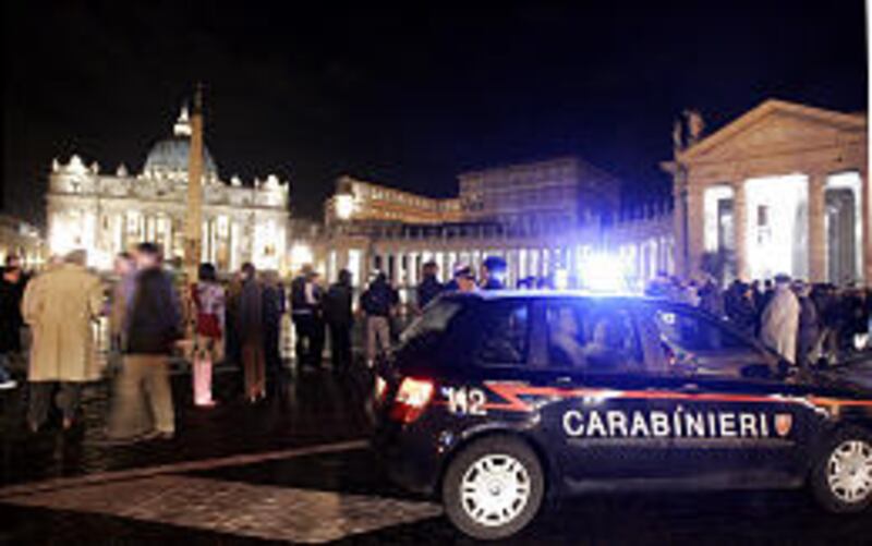 An Italian Carabinieri, paramilitary police, car patrols outside St. Peter's square at the Vatican late Thursday. Inside, Pope John Paul II is suffering a urinary tract infection.