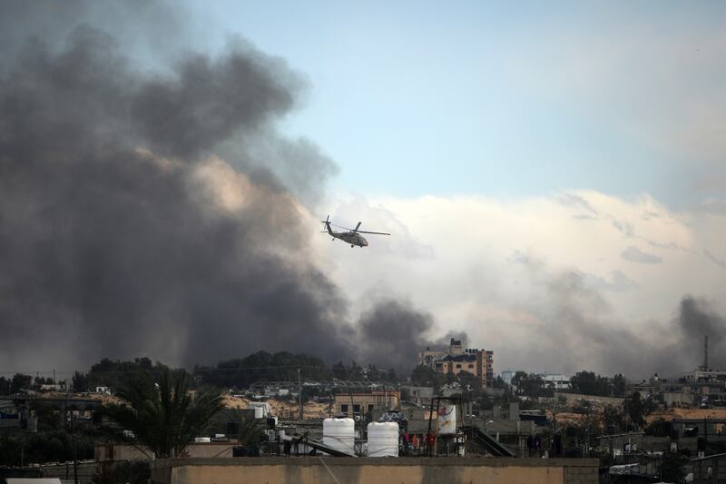An Israeli helicopter flies over Khan Younis, Gaza Strip, on Feb. 15, 2024.