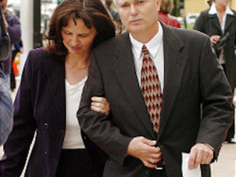 John Daniel Kingston leaves courthouse with Rachel Young, spokeswoman for the Kingston Cooperative.