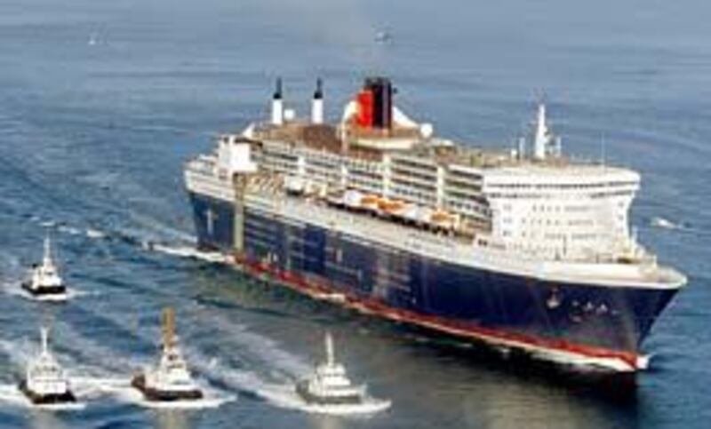 The Queen Mary 2, soon to be the longest, tallest and most expensive passenger ship ever constructed, leaves the Saint Nazaire port in western France.
