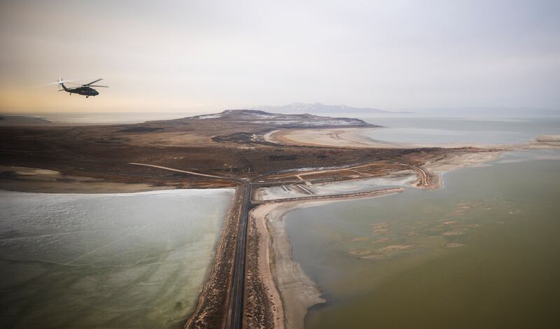 A Black hawk helicopter flies over the Great Salt Lake as Utah lawmakers take an aerial tour of the Great Salt Lake.