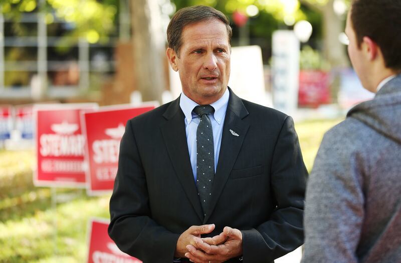 Rep. Chris Stewart, R-Utah, talks with a student while campaigning at the University of Utah in Salt Lake City on Oct 16, 2018.