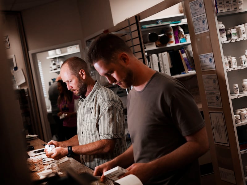 Trevor Jolley, left, and Jordan Jolley fill prescriptions at Jolley’s Pharmacy in West Jordan on Thursday, July 7, 2022.