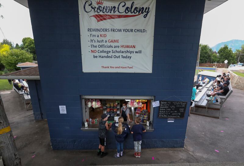 Kids order snacks outside.