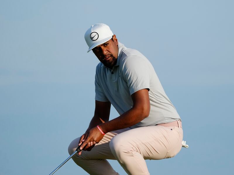 Tony Finau reacts after putting on the first day of the British Open Golf Championships at the Royal Liverpool Golf Club.