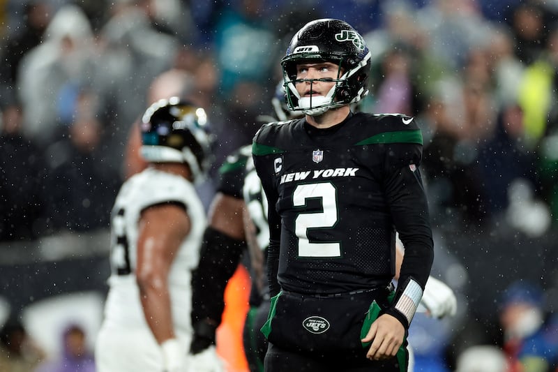 New York Jets quarterback Zach Wilson (2) reacts against the Jacksonville Jaguars during an NFL football game Thursday, Dec. 22, 2022, in East Rutherford, N.J.