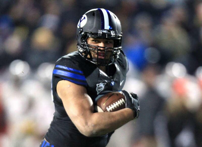 Brigham Young Cougars running back Paul Lasike runs for the touchdown during the football game against UNLV in the LaVell Edwards Stadium Saturday, Nov. 15, 2014, in Provo.