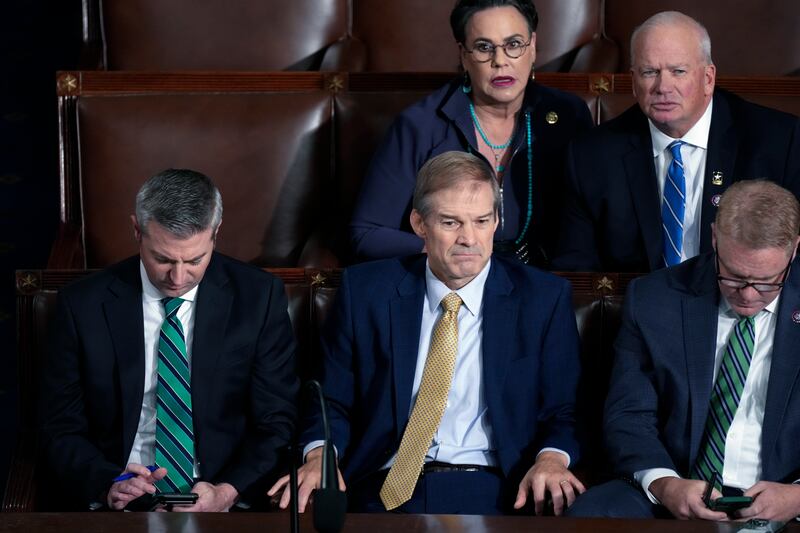 Rep. Jim Jordan, R-Ohio, center, and others, look on as the vote is counted for a third ballot to elect a House speaker, in Washington, on Oct. 20, 2023.